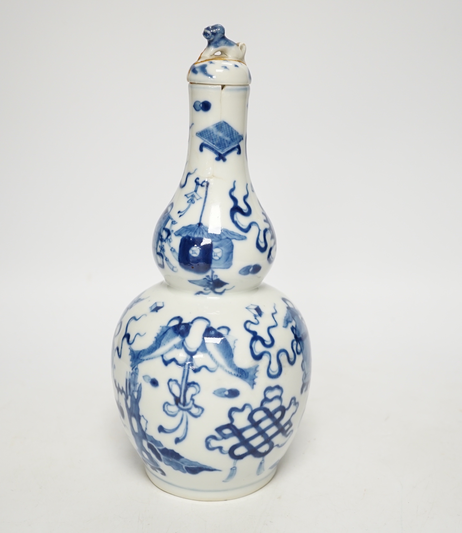 A late 19th century Chinese blue and white double gourd vase and cover 26cm high